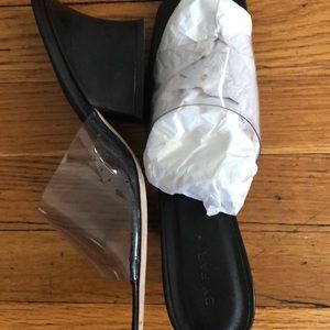 By Far black leather and vinyl mules